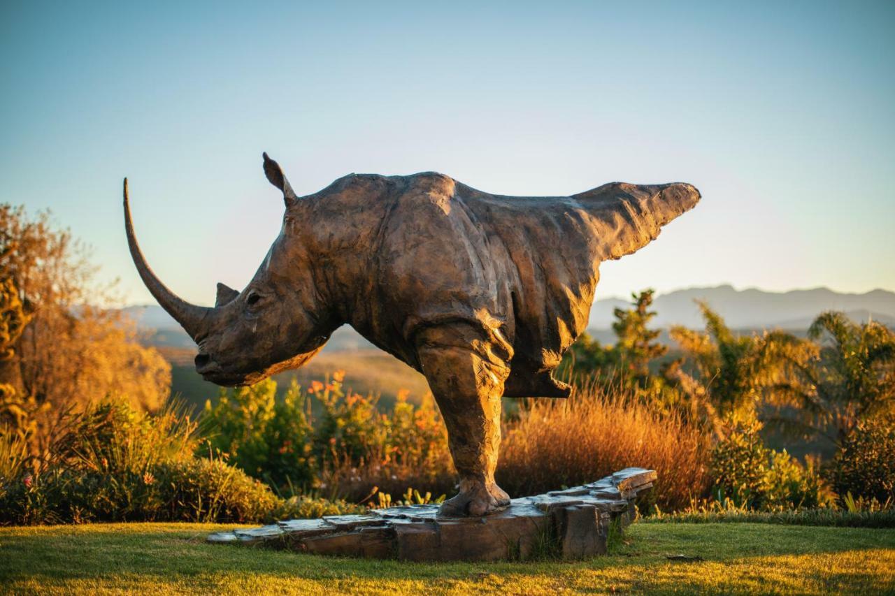 Sky Villa Boutique Hotel By Raw Africa Collection Plettenbergbaai Buitenkant foto The sculpture of a white rhinoceros at the entrance of the park